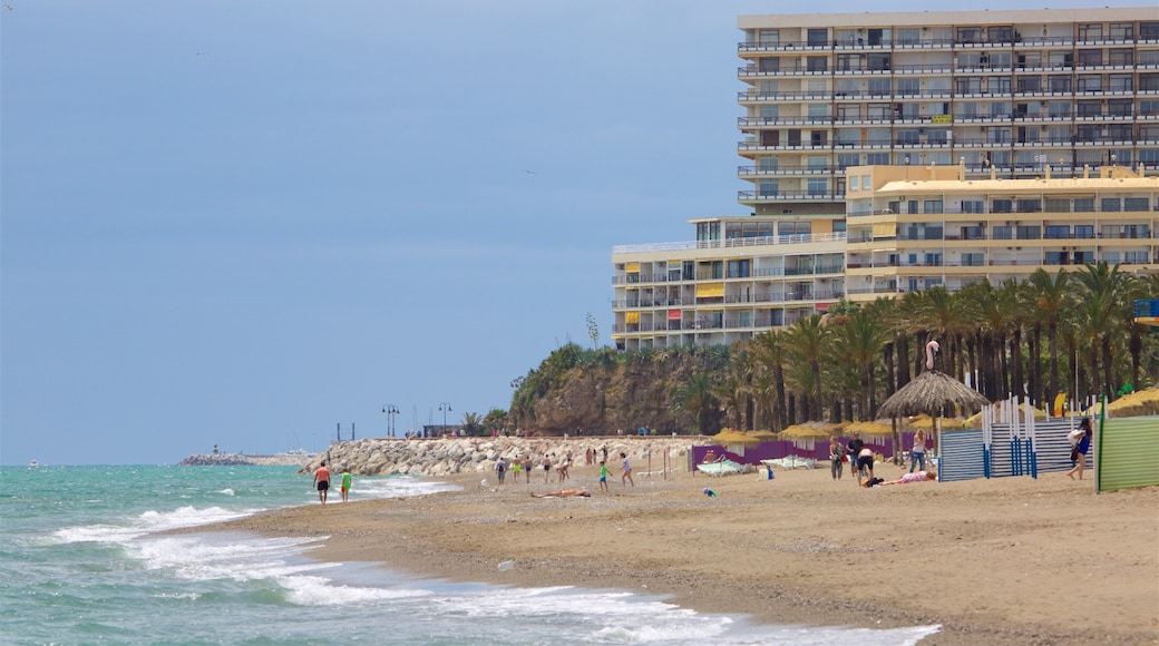 Torremolinos showing a coastal town and a sandy beach