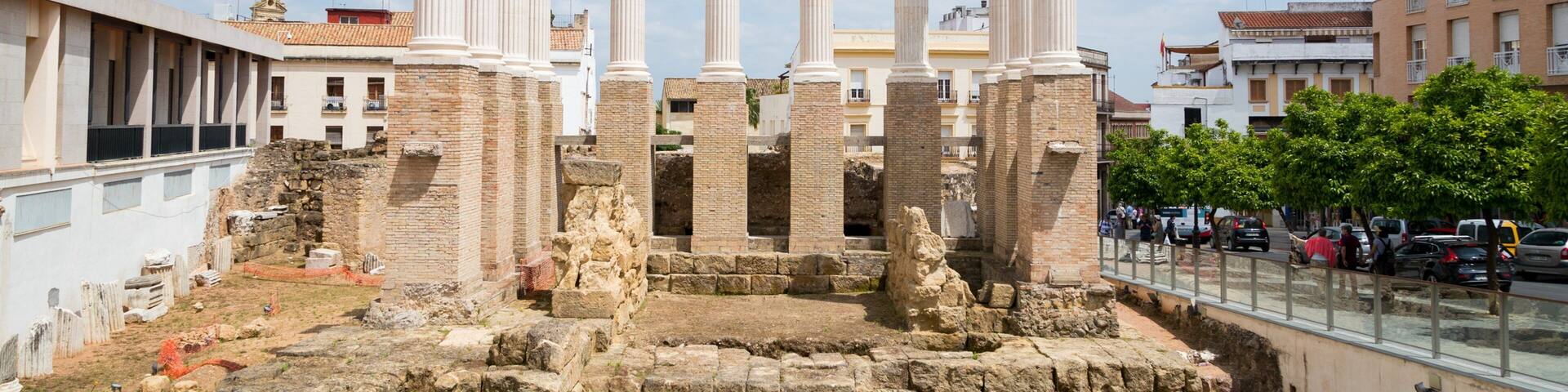 Ancient ruins with columns and stone structures.