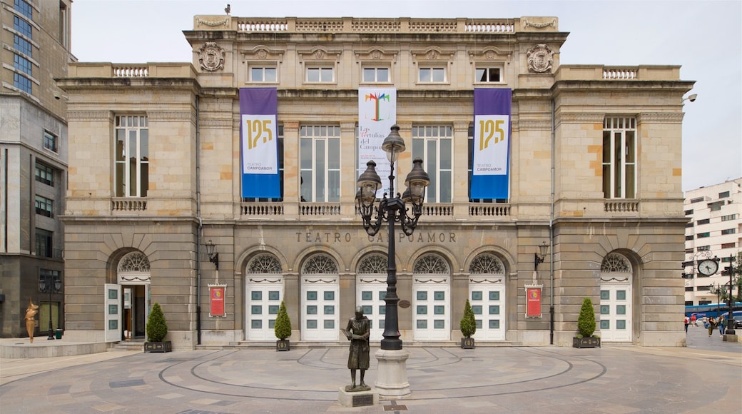 Campoamor Theater featuring a statue or sculpture, a city and heritage elements
