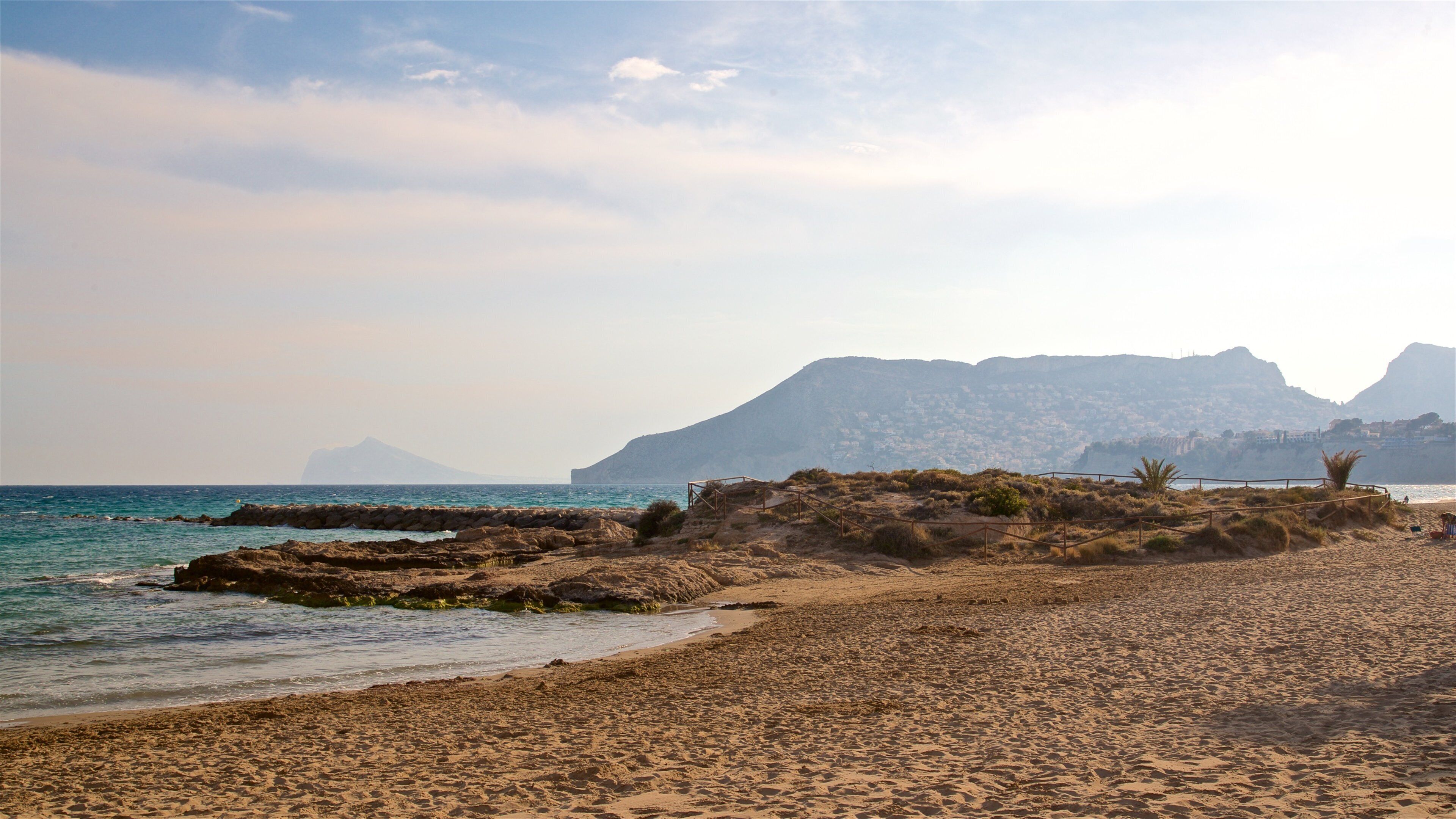 Banos de la Reina Archaelogical Site showing a sunset, general coastal views and rocky coastline