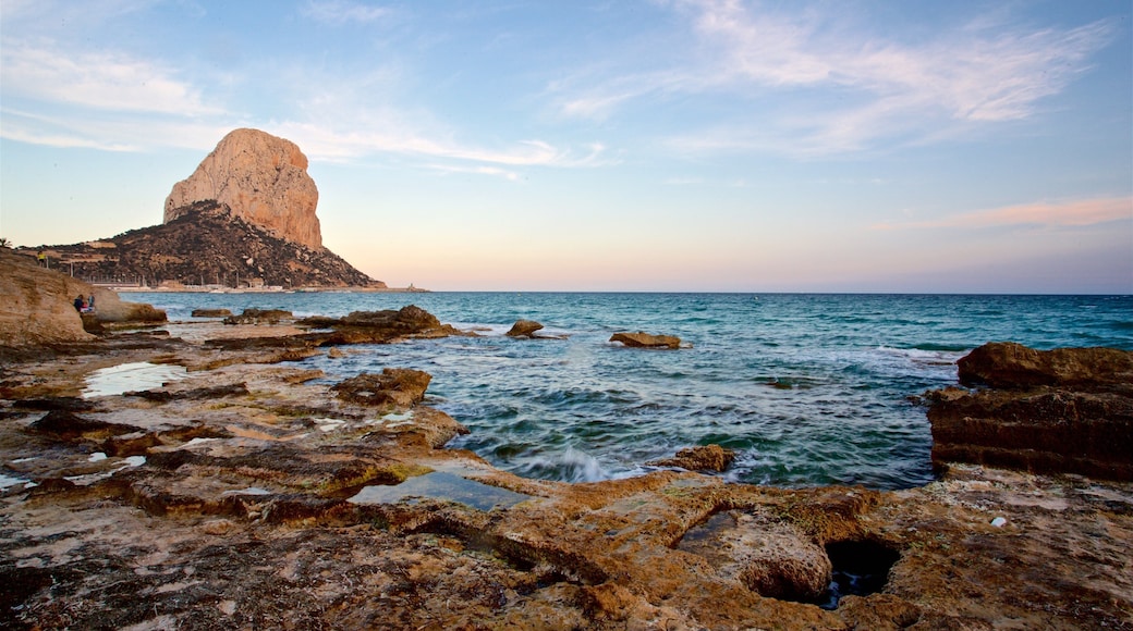 Banos de la Reina Archaelogical Site featuring a sunset, rocky coastline and general coastal views