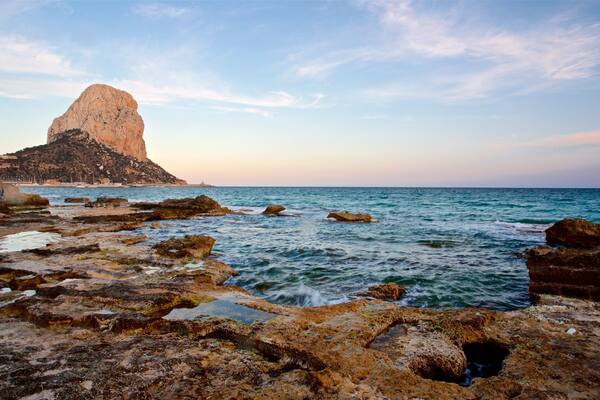 Banos de la Reina Archaelogical Site featuring a sunset, rocky coastline and general coastal views