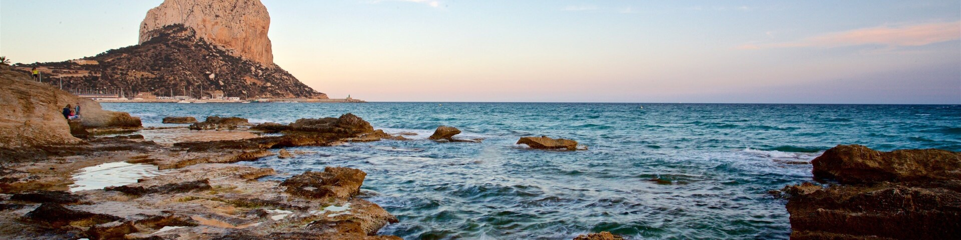 Banos de la Reina Archaelogical Site featuring a sunset, rocky coastline and general coastal views