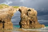 Las Catedrales beach, Ribadeo, Spain. Last ray of sun in the early morning before the rain.