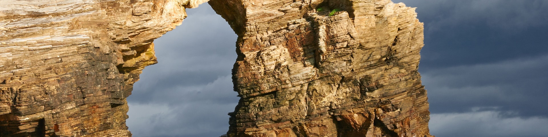 Las Catedrales beach, Ribadeo, Spain. Last ray of sun in the early morning before the rain.