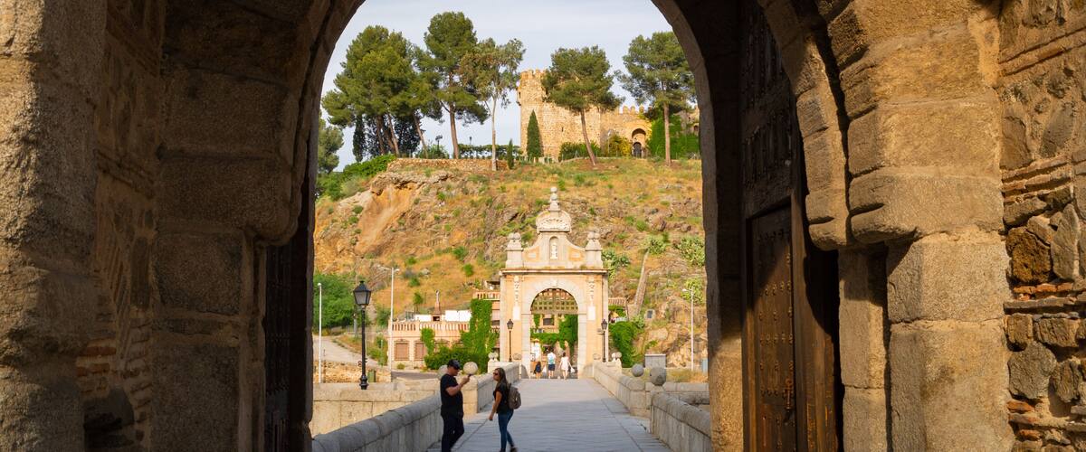 Puente de Alcantara showing heritage elements and a bridge as well as a couple