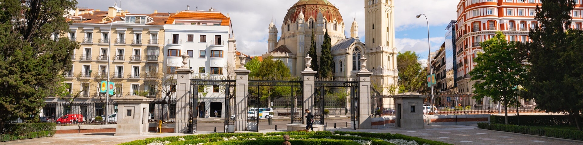 Church of San Manuel y San Benito which includes heritage architecture, a garden and flowers