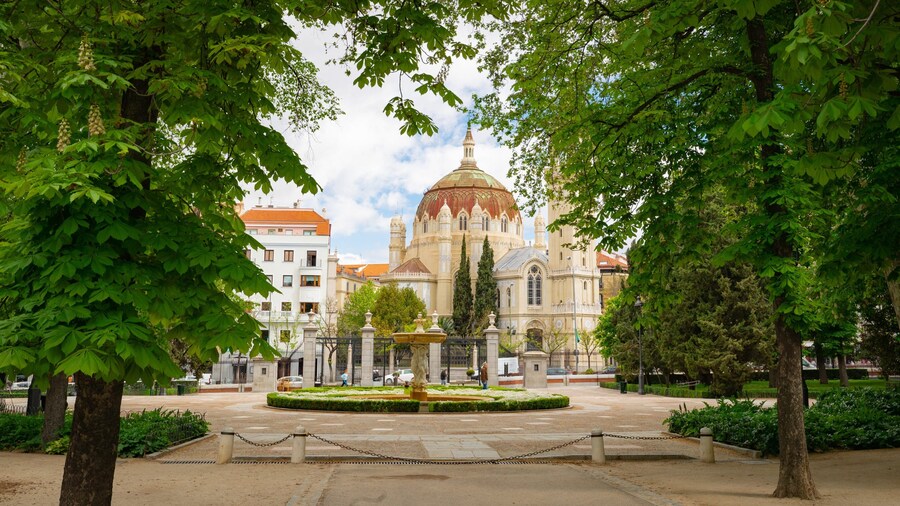 Church of San Manuel y San Benito featuring heritage architecture and a park