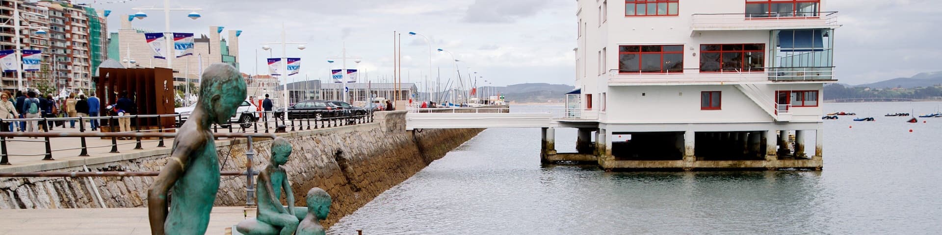 Monumento a Los Raqueros featuring a river or creek, outdoor art and a statue or sculpture