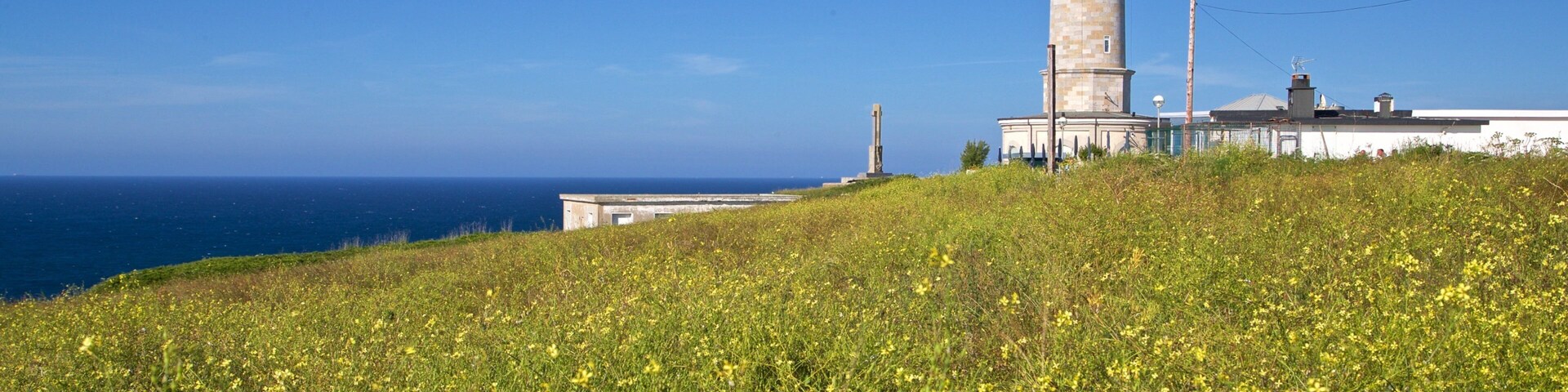 Cabo Mayor Lighthouse featuring general coastal views, wildflowers and a lighthouse