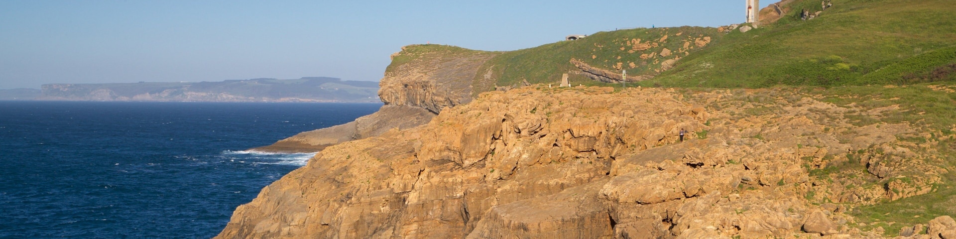 Cabo Mayor Lighthouse which includes general coastal views, a lighthouse and rocky coastline