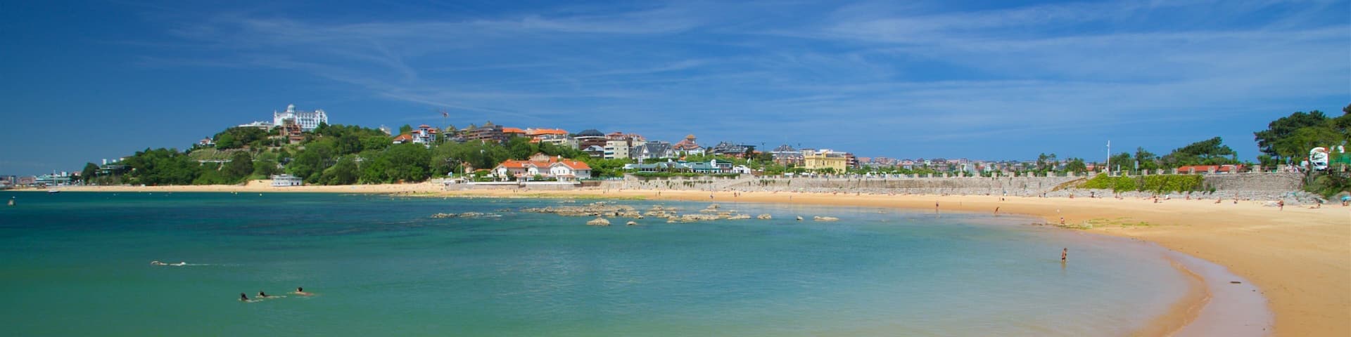 Magdalena Beach showing a coastal town, a beach and general coastal views