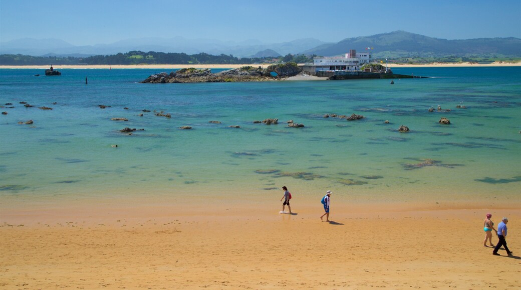 Bikini Beach showing general coastal views and a sandy beach as well as a small group of people