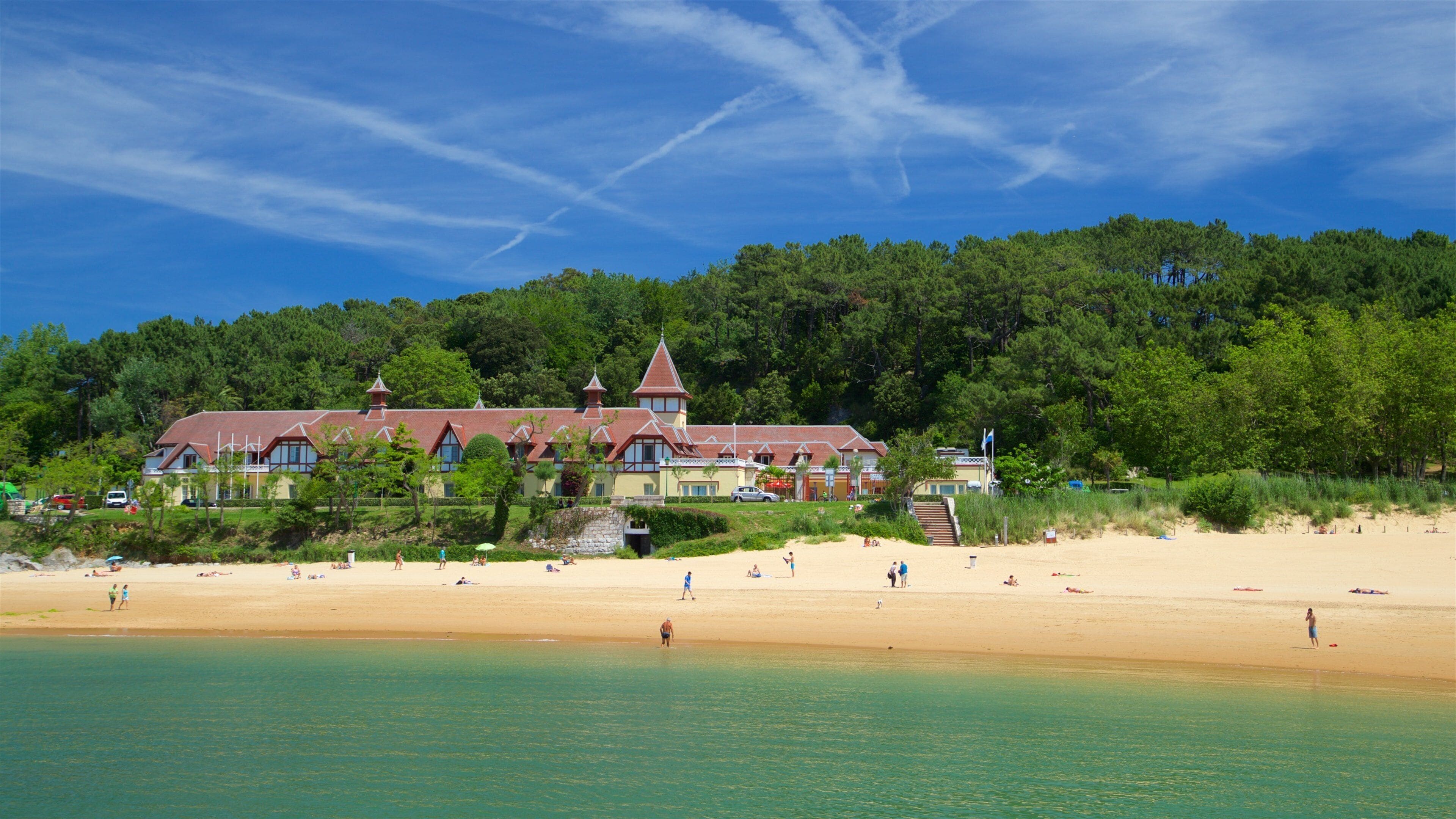 Magdalena Beach which includes a sandy beach, a coastal town and general coastal views