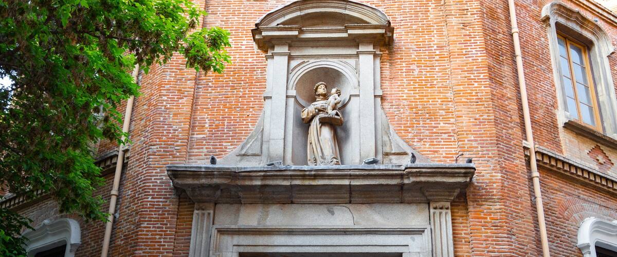 Church of San Antonio de los Alemanes featuring heritage elements and a statue or sculpture