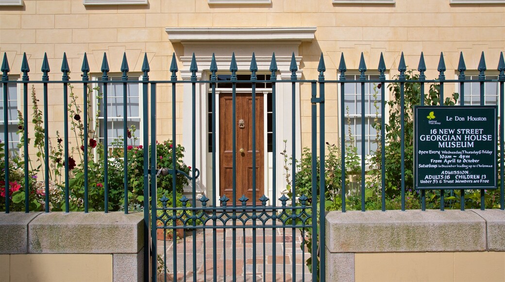 The Georgian House featuring a house and signage