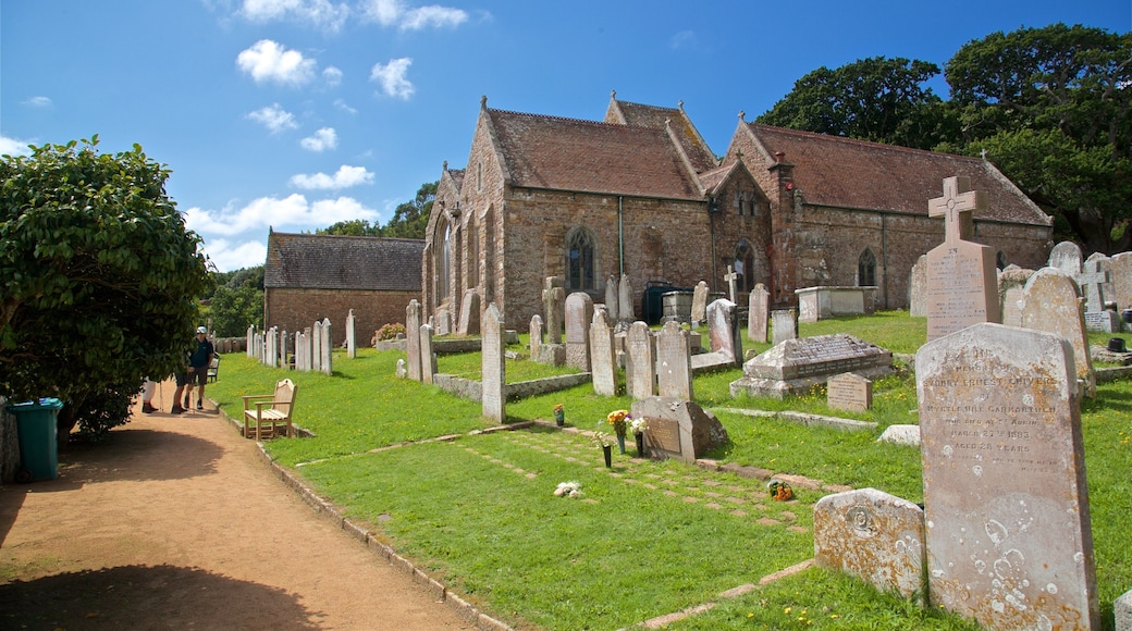 Parish Church of St. Brelade showing a church or cathedral, heritage elements and a cemetery