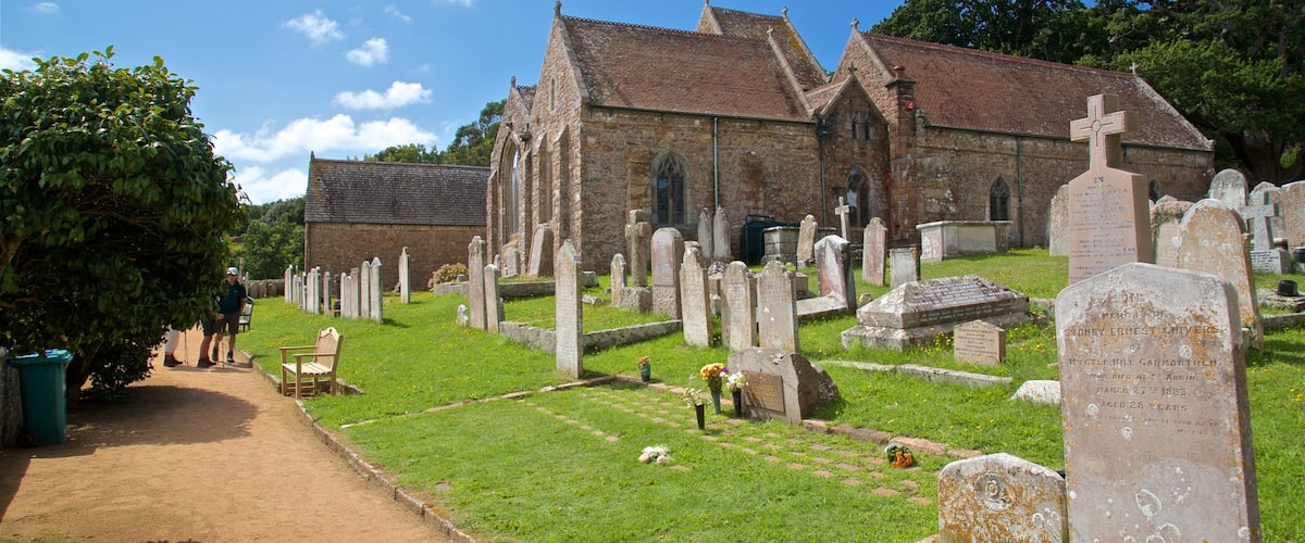 Parish Church of St. Brelade showing a church or cathedral, heritage elements and a cemetery