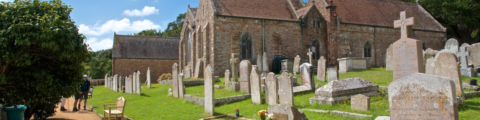 Parish Church of St. Brelade showing a church or cathedral, heritage elements and a cemetery