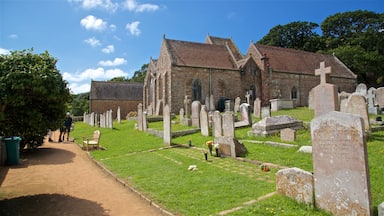 Parish Church of St. Brelade showing a church or cathedral, heritage elements and a cemetery