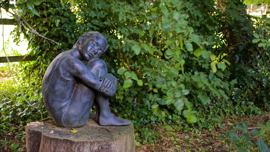 Sausmarez Manor featuring a statue or sculpture, outdoor art and a garden