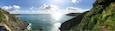 A coastal landscape with cliffs and a clear view of the sea.