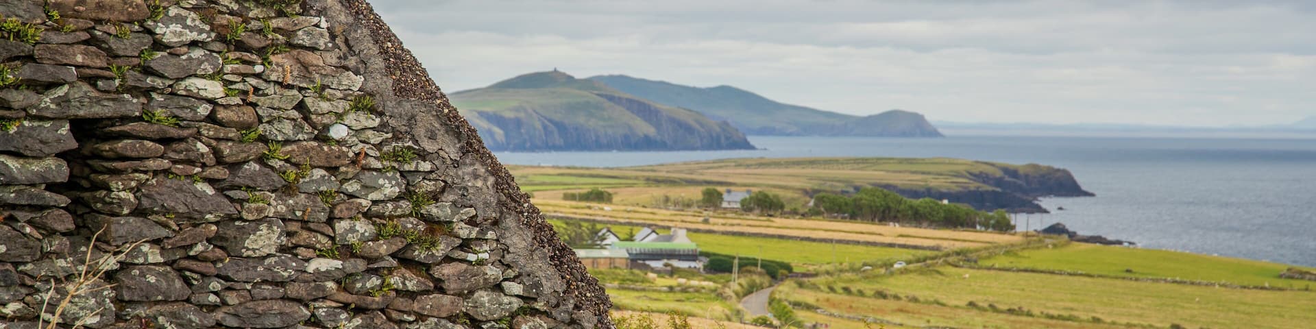 Irish Famine Cottages featuring heritage elements and general coastal views