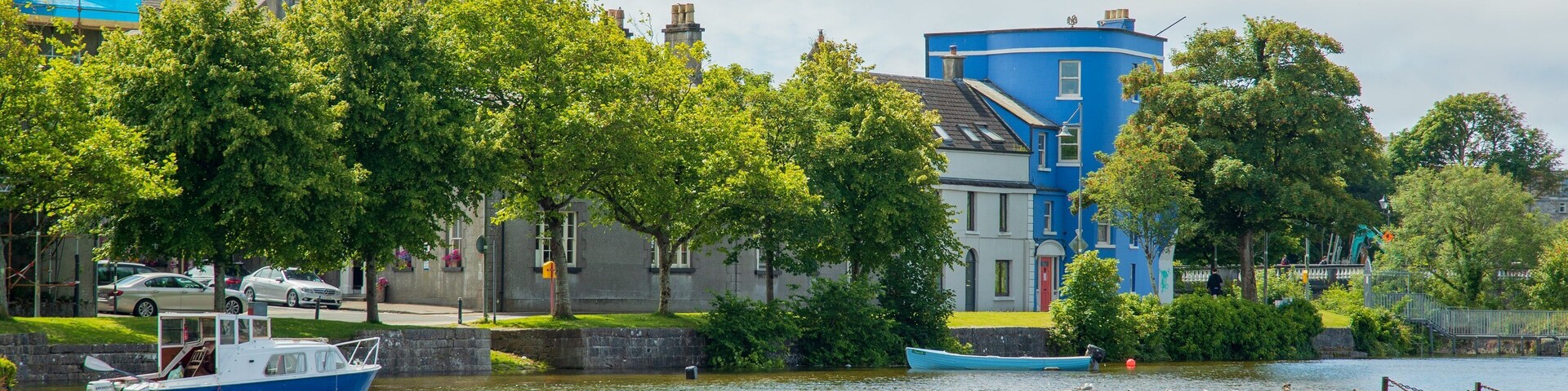 Riverside Walk which includes a bay or harbor