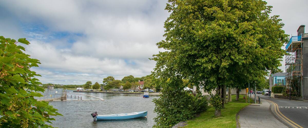 Riverside Walk which includes a bay or harbor