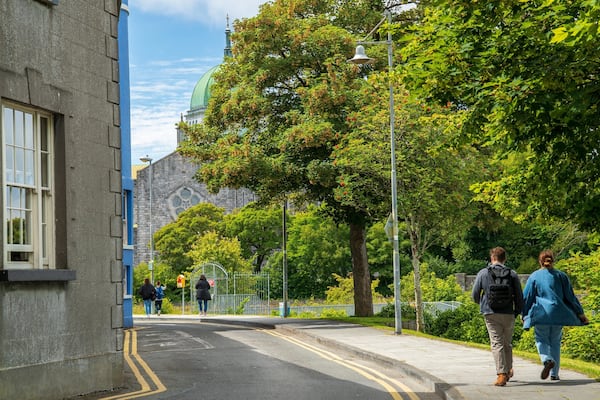 Riverside Walk featuring street scenes as well as a couple