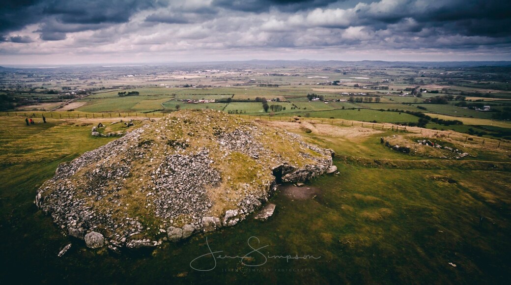 Loughcrew is near Oldcastle, County Meath, Ireland. Loughcrew is a site of considerable historical importance in Ireland. It is the site of megalithic burial grounds dating back to approximately 3500 and 3300 BC, situated near the summit of Sliabh na Caillí and on surrounding hills and valleys. Passage tombs on the site are aligned with the Equinox sunrise.