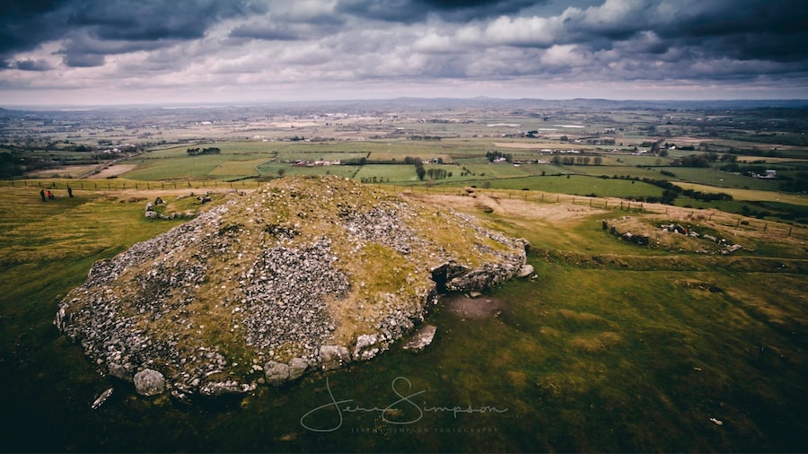 Loughcrew is near Oldcastle, County Meath, Ireland. Loughcrew is a site of considerable historical importance in Ireland. It is the site of megalithic burial grounds dating back to approximately 3500 and 3300 BC, situated near the summit of Sliabh na Caillí and on surrounding hills and valleys. Passage tombs on the site are aligned with the Equinox sunrise.