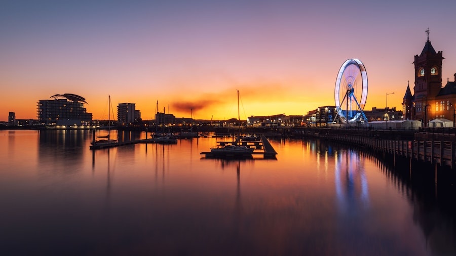 Big Wheel, Pier head building and ferris building located in Mermaid Quay of Cardiff Bay - Cardiff, Wales, United Kingdom at Night