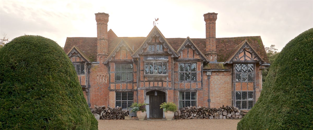 Dorney Court which includes a house, heritage elements and a sunset
