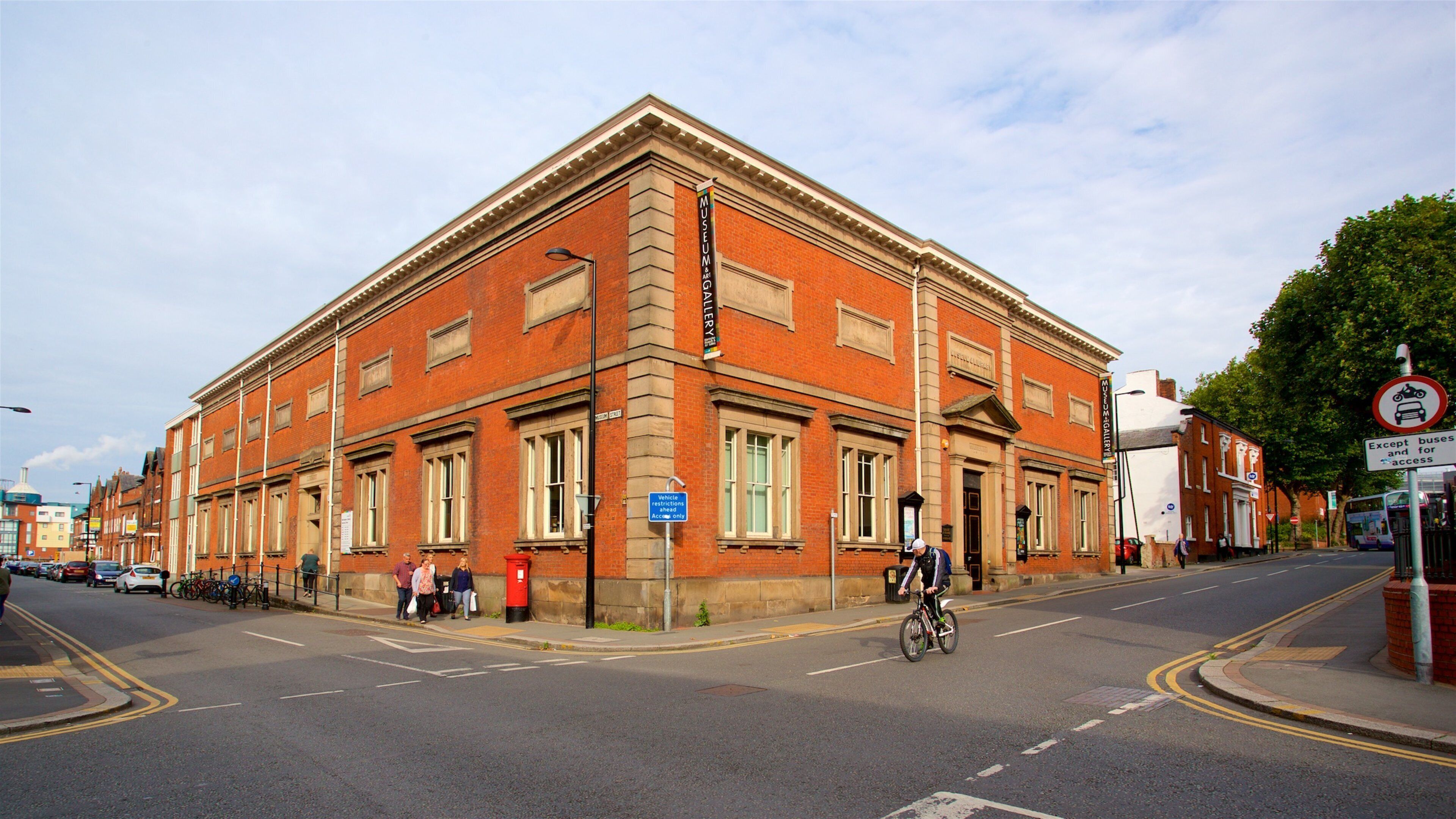 A red brick building with a sign for the Museum & Gallery.
