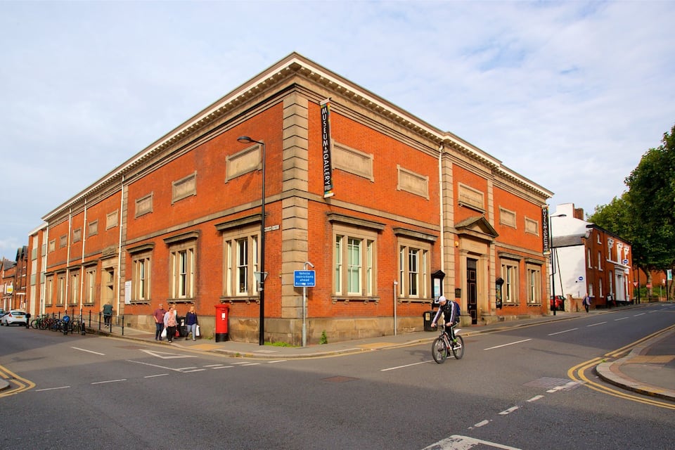 A red brick building with a sign for the Museum & Gallery.