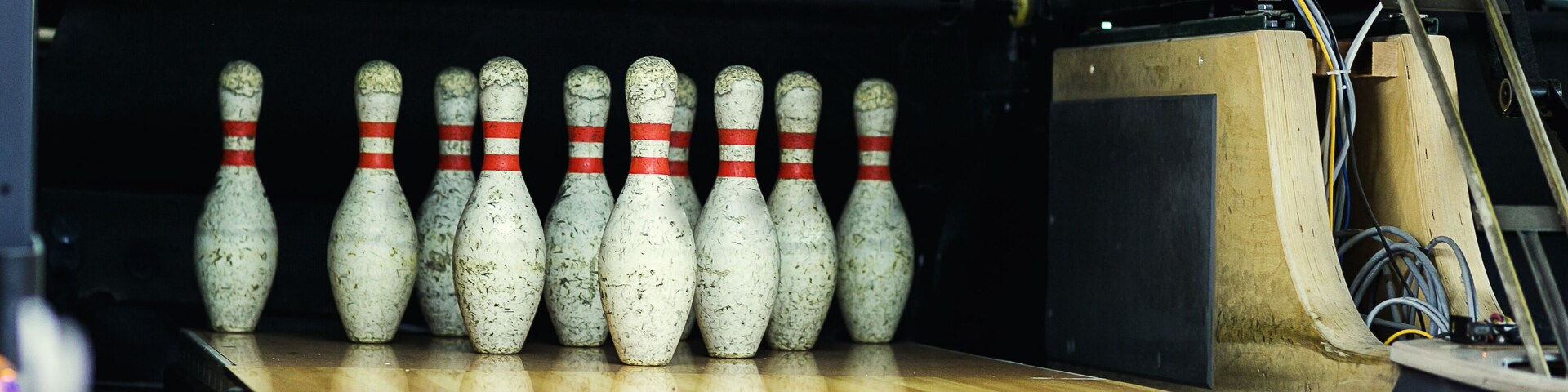Pins at the end of a bowling alley,Skittles for bowling,bowling game; Shutterstock ID 609787733; Purchase Order: -