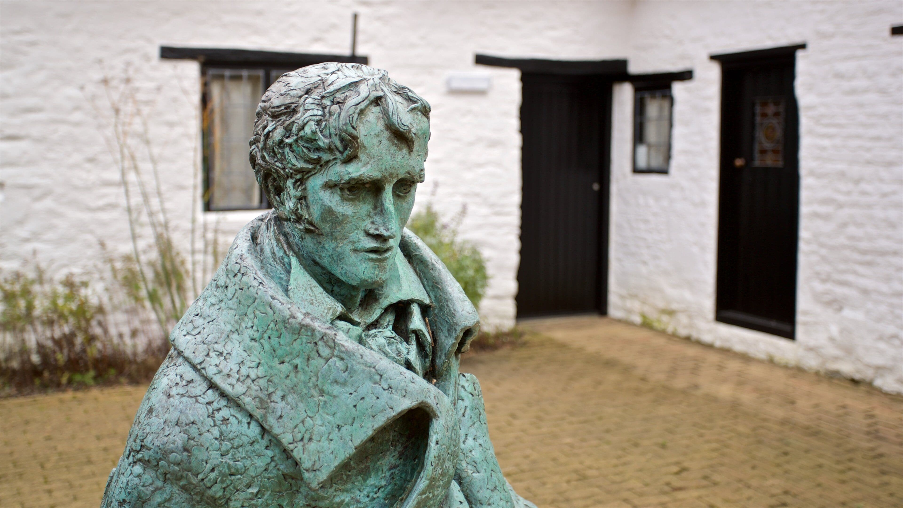 John Clare Cottage which includes a statue or sculpture