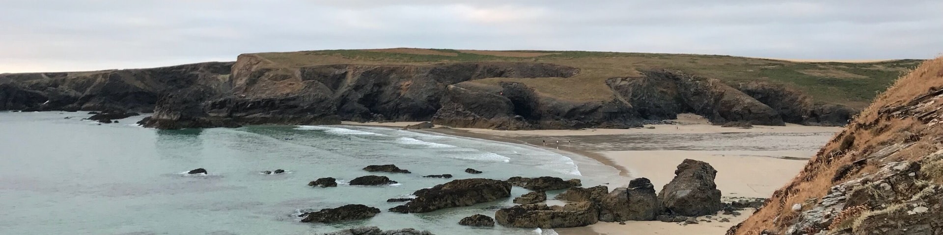 Treyarnon Bay in North Cornwall is a lovely bay surrounded by cliffs with amazing views. Itâs a popular beach for families and for dog owners. Very busy in summer and the RNLI on duty during the Summer months are nice, chatty & helpful. Plus thereâs plenty of rock pools to explore. Heaps of fun for all!