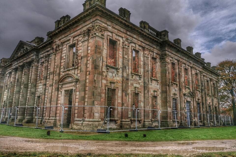 A historic building with classical architecture, featuring columns and ornate detailing.