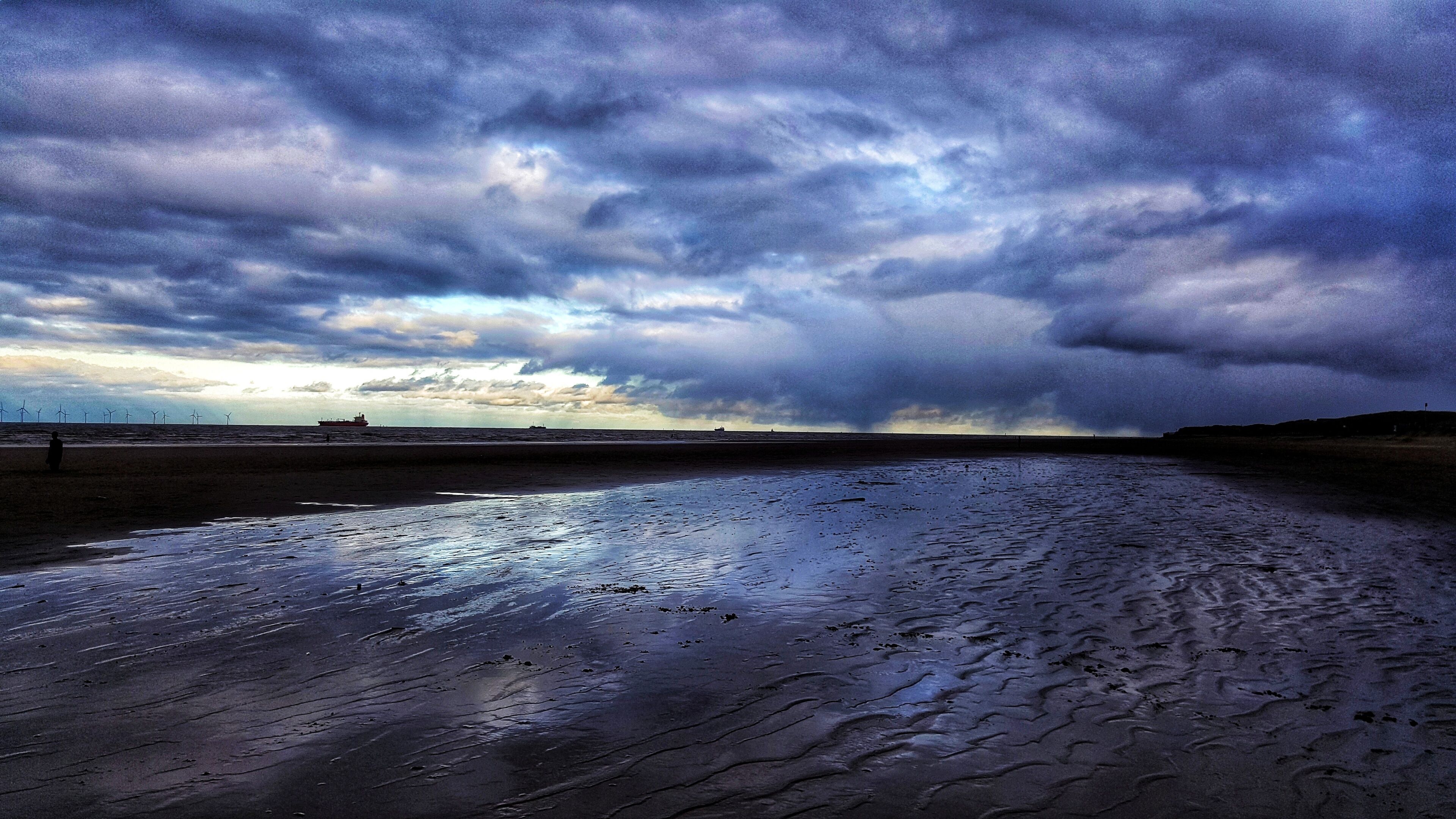 Moody skies over Crosby beach, Merseyside. 
Taken on a Sony Nex5 with a Sony 16mm lens.
