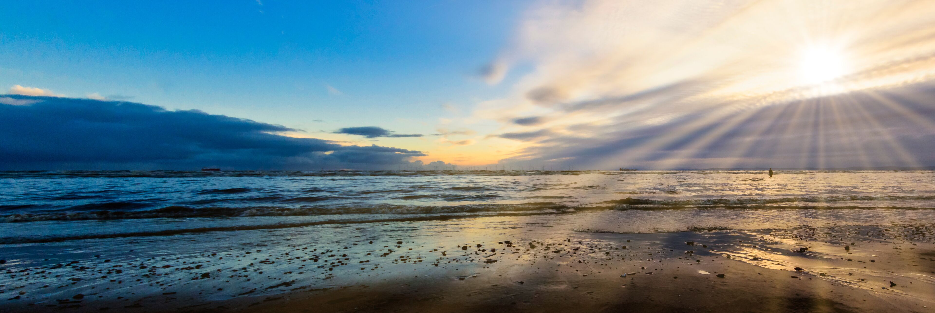 Sunset on Crosby Beach in winter, Crosby, Liverpool, United Kingdom