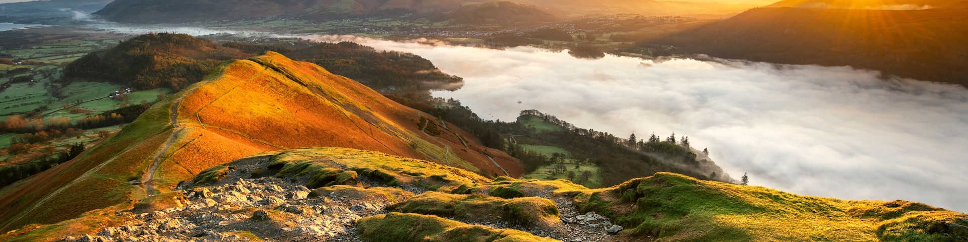Beautiful Sunrise Overlooking Derwentwater From Catbells On A Sunny Calm Morning With Cloud Inversion Mist Over Lake. Lake District National Park, UK.