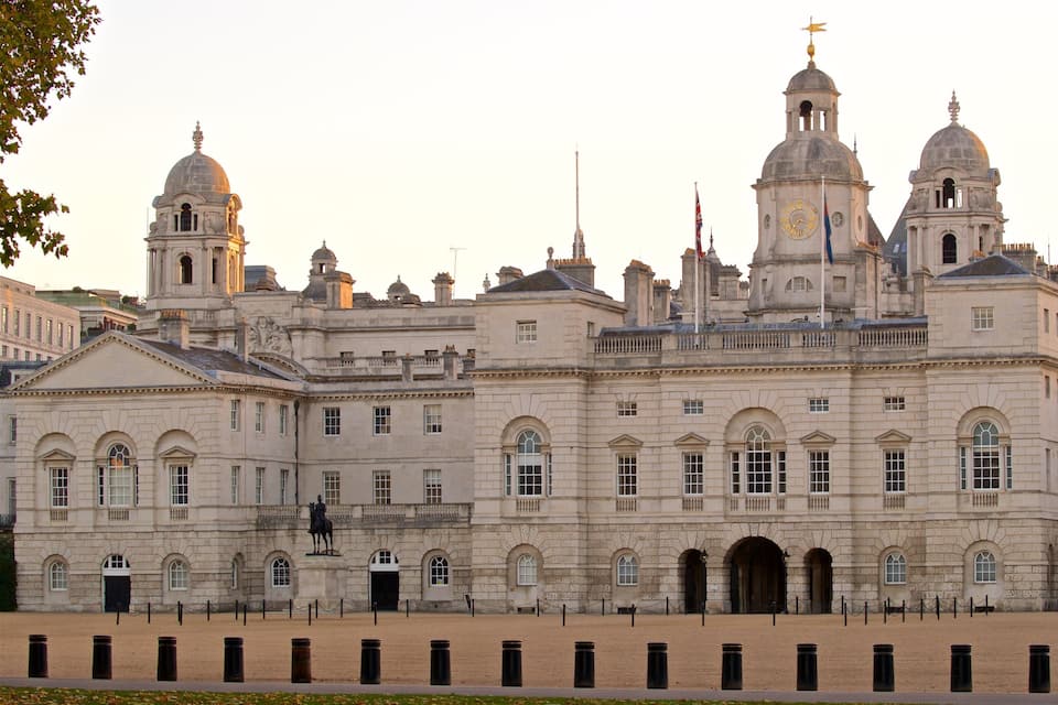 A historic building with multiple domes and a prominent clock tower.