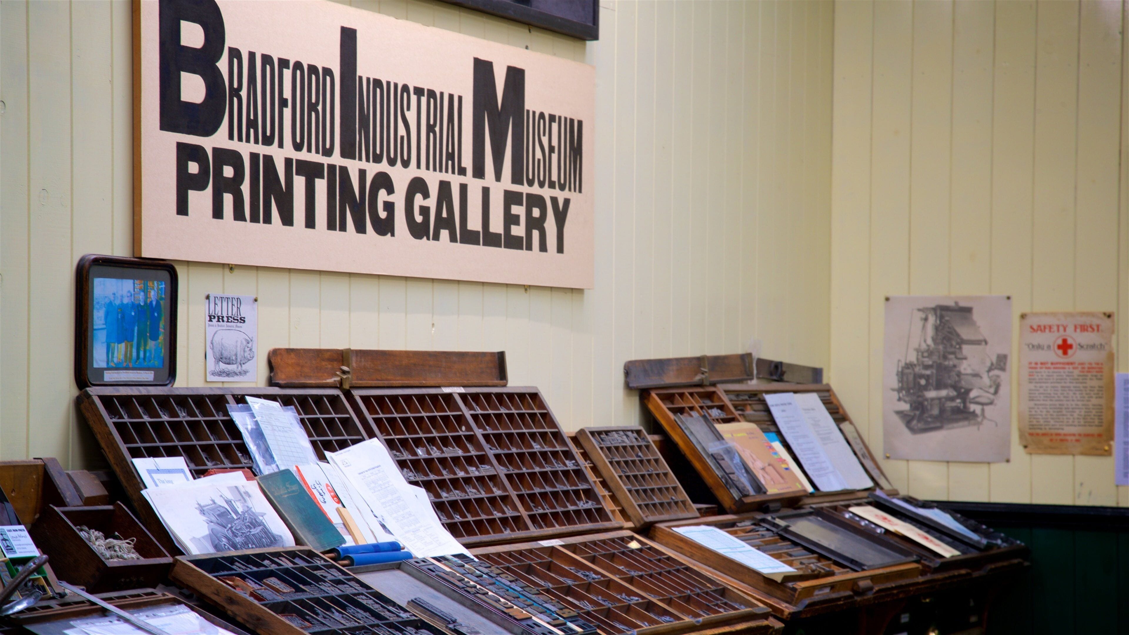 A printing gallery with various printing presses and equipment.