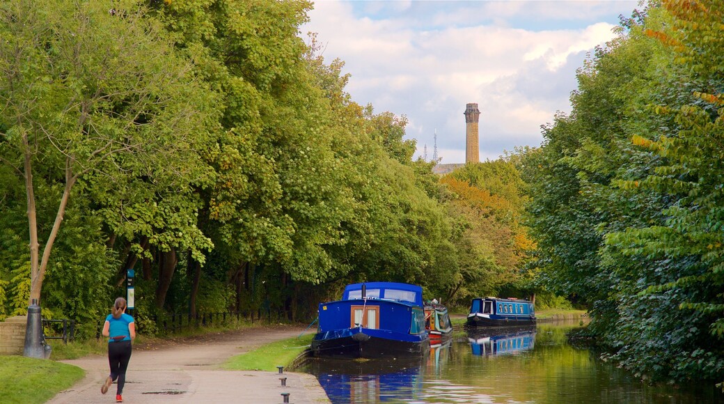 Salts Mill showing hiking or walking and a river or creek as well as an individual femail