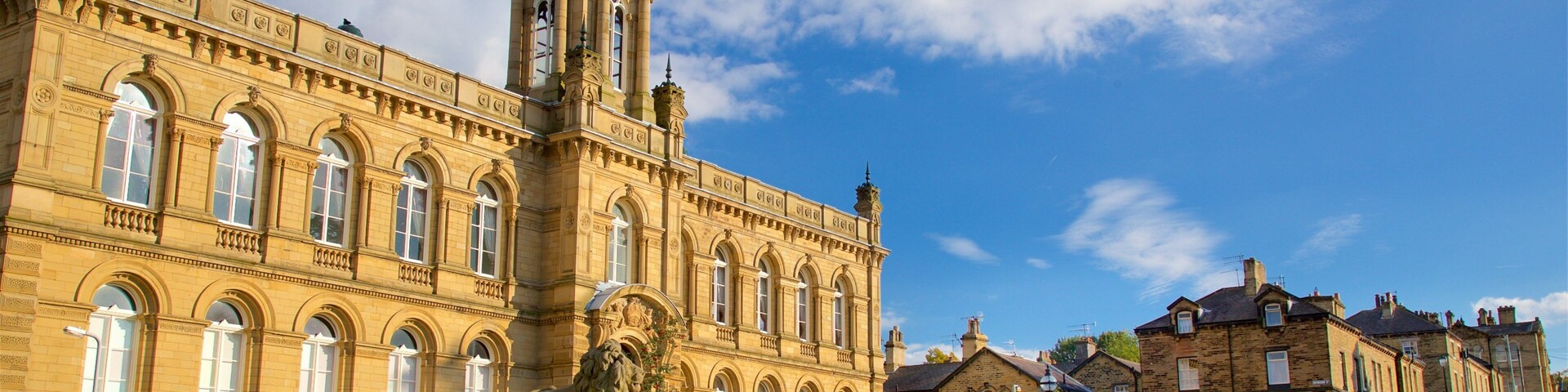 A historic building with arched windows and a tower.