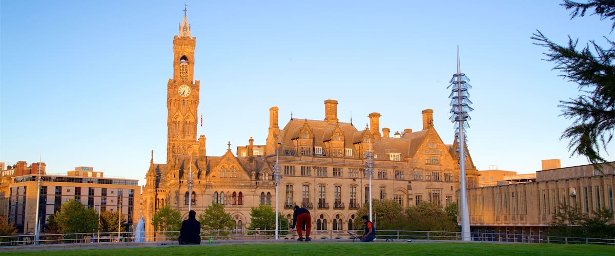 Bradford City Hall featuring a sunset, a park and heritage architecture