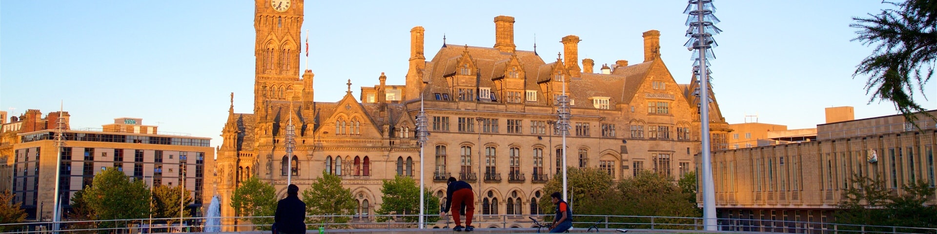 Bradford City Hall featuring a sunset, a park and heritage architecture