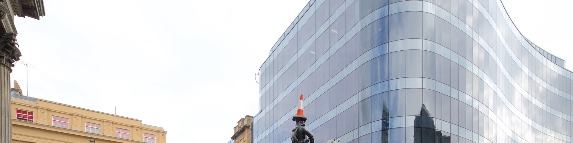 Glasgow featuring modern architecture and a statue or sculpture